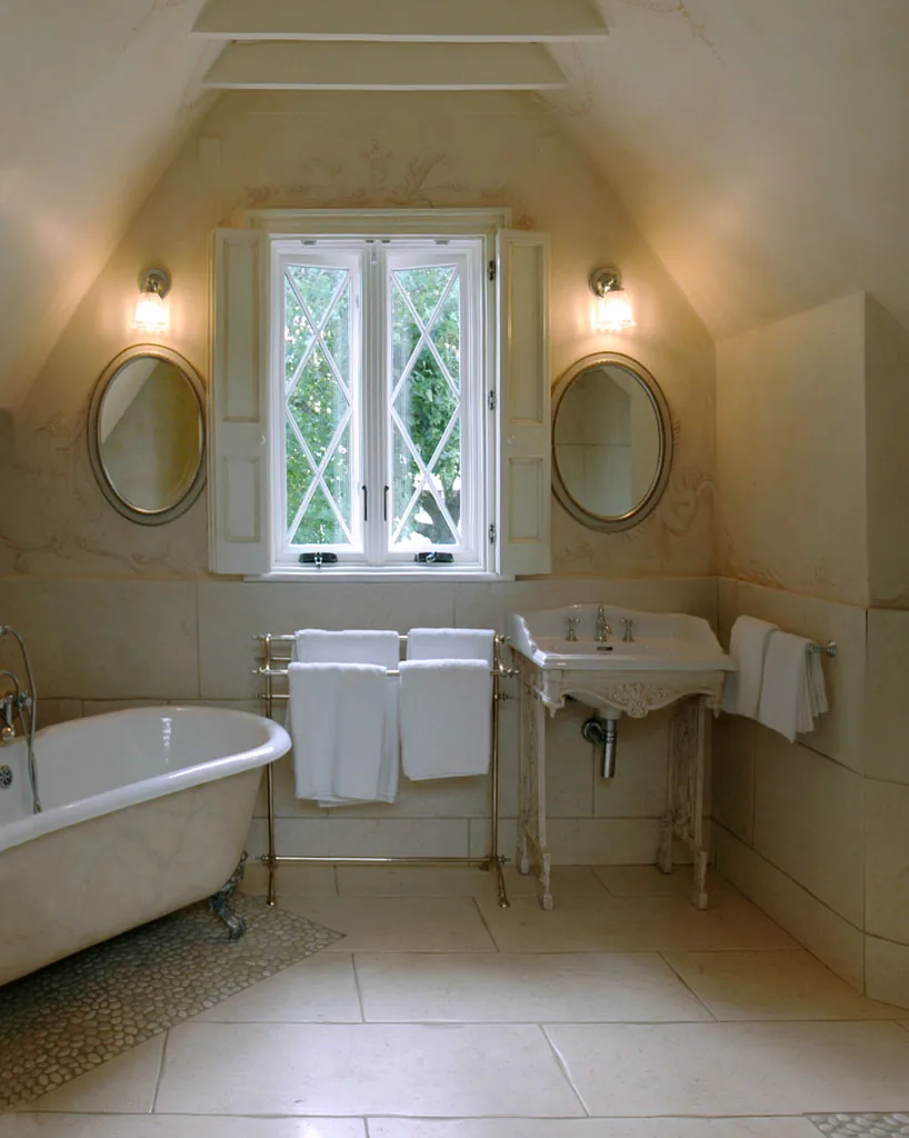 Guest bath in soft plaster and warm brass — House, Clontarf, Dublin 3