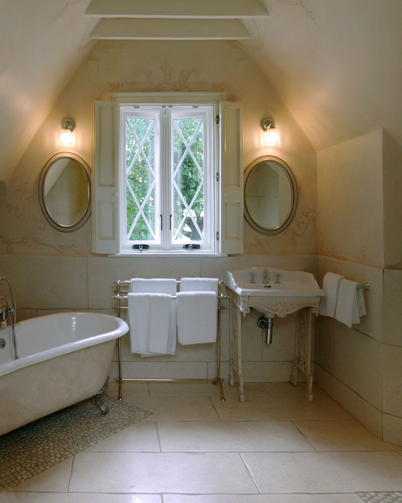 Guest bath in soft plaster and warm brass — House, Clontarf, Dublin 3